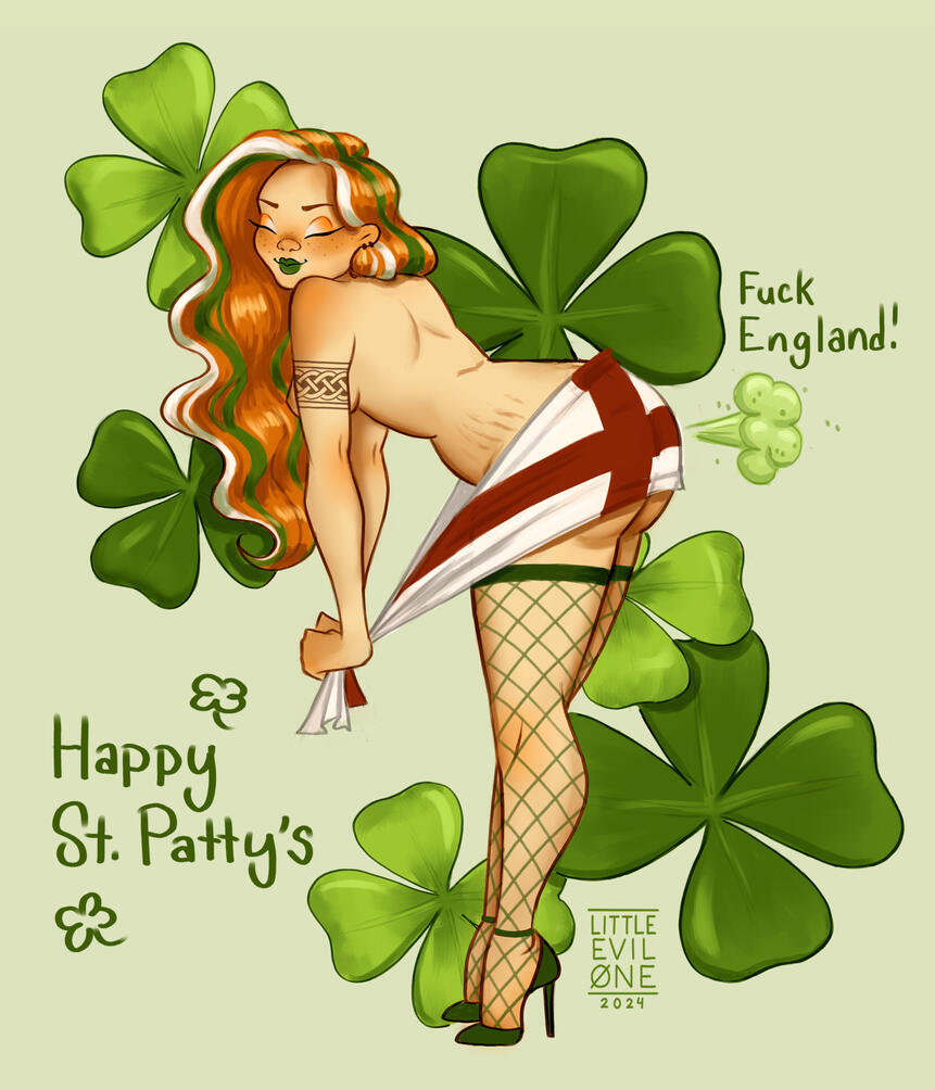 An irish redhead with white and green stripes in her hair wearing nothing but a thong and fishnets poses in front of four leaf clovers