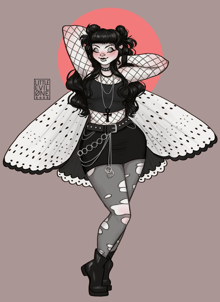 goth moth Pale white goth girl in fishnets, chains and tights with black and white moth wings spread out behind her